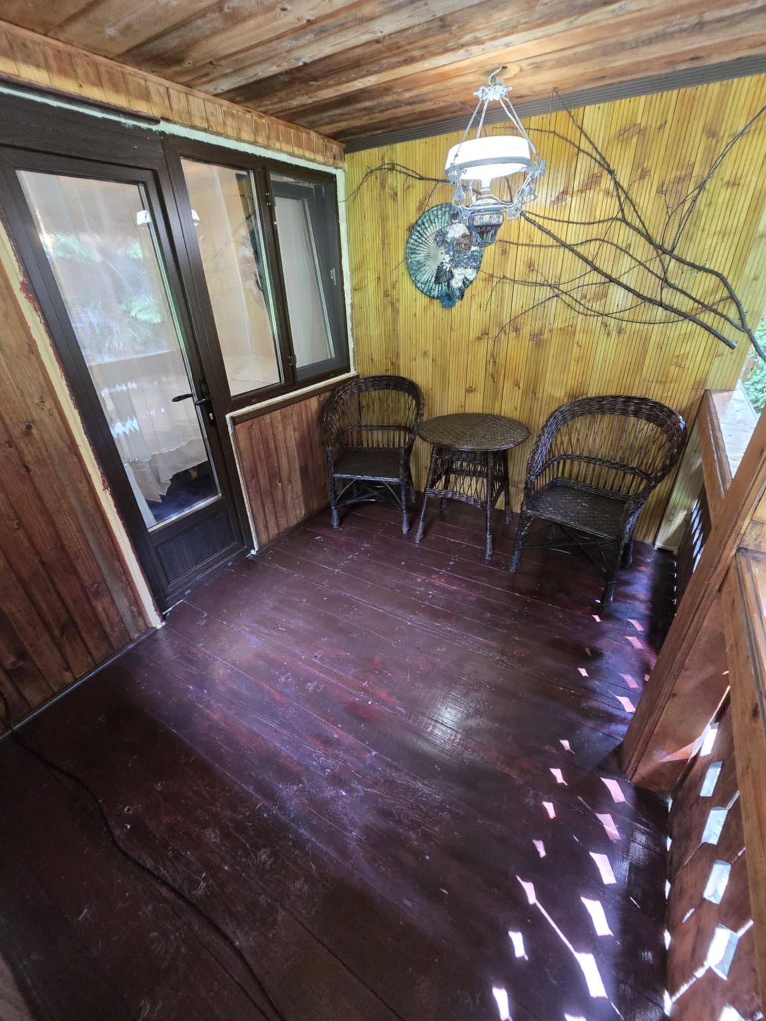 Side view along the sheltered wooden balcony.
